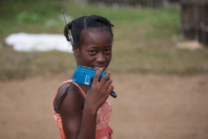 Girl in West Africa with wind up radio