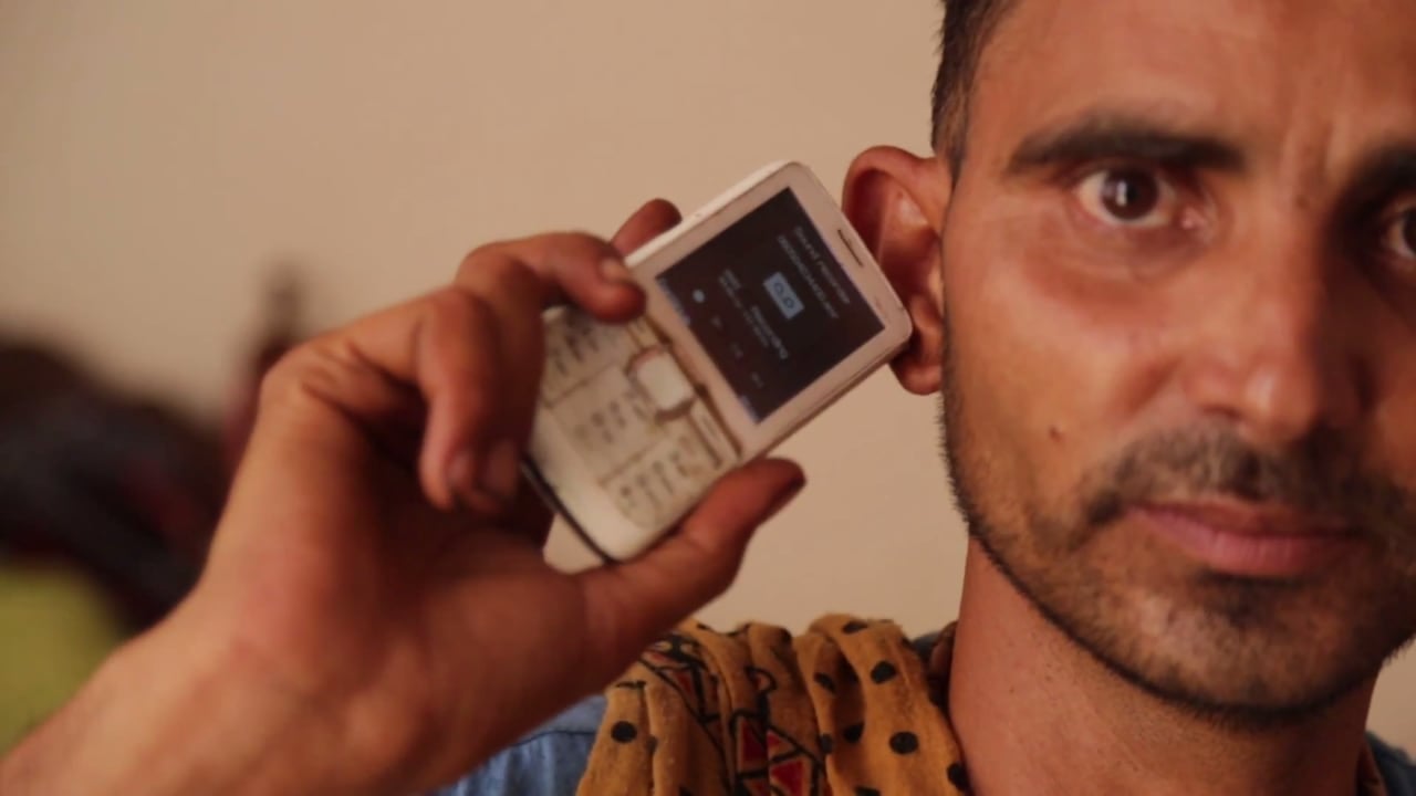 Chatur listeners to Udaan using a card on his mobile phone