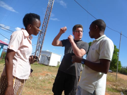 Farida working with engineer Paul & technician Nelson in front of Wimbes mast