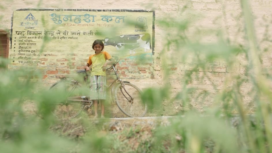 A girl in northern India with her bicycle