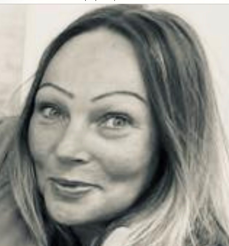Black and white headshot of Naomi, Feba's Operations Officer, smiling.