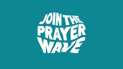 Wavy text on a teal background that reads join the prayer wave.