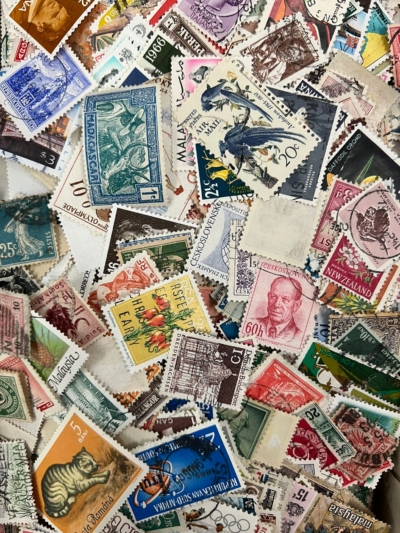Overhead shot of colourful stamps from different countries.